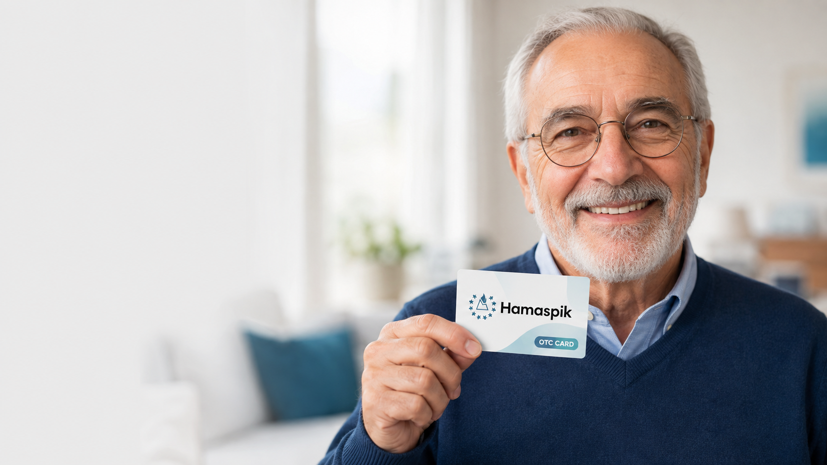 Smiling older man holding a Hamaspik OTC benefits card